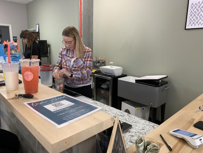 Chanin Wynstra prepares a drink for a customer