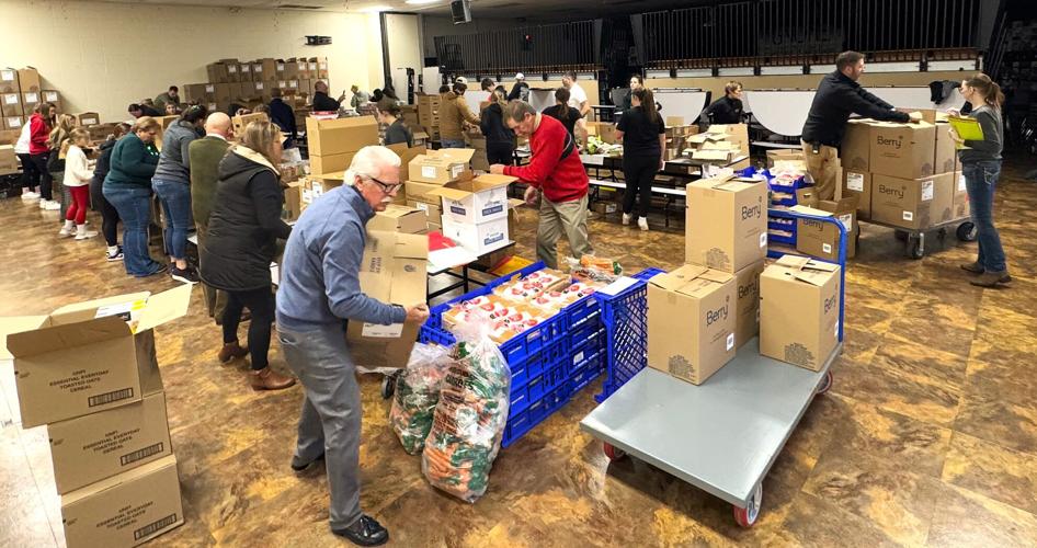 Geneva Lake West Rotary Club Holiday Food Assistance Program packing event at Walworth Elementary School