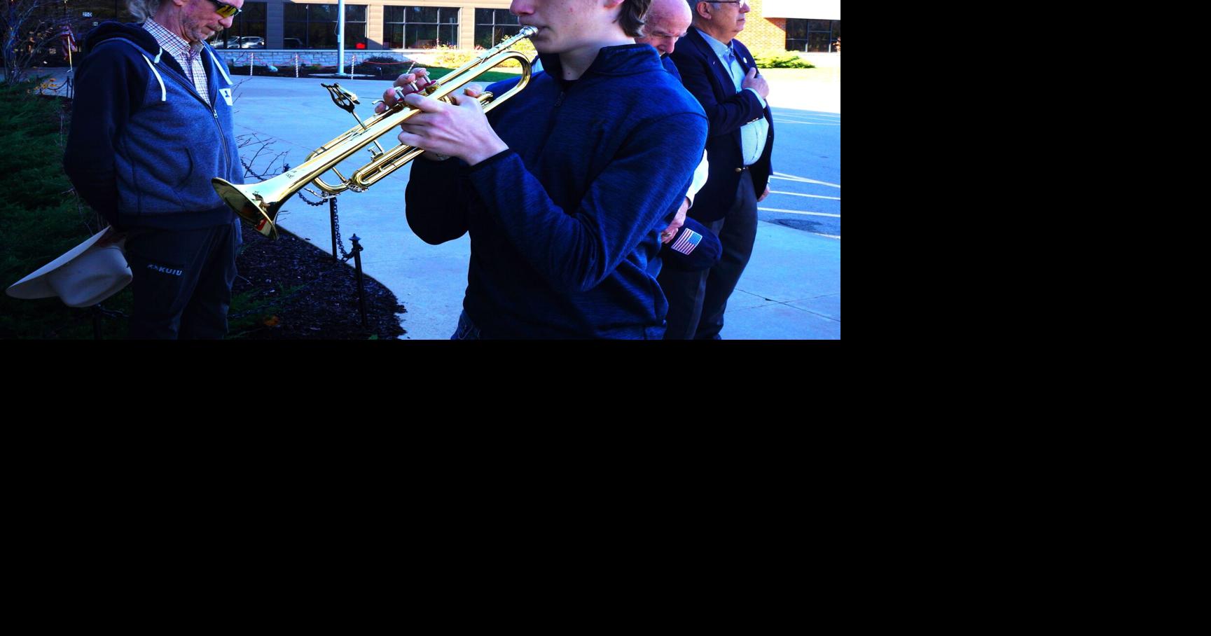Williams Bay High School senior Hunter Johnson plays "Taps" at Nov. 9
