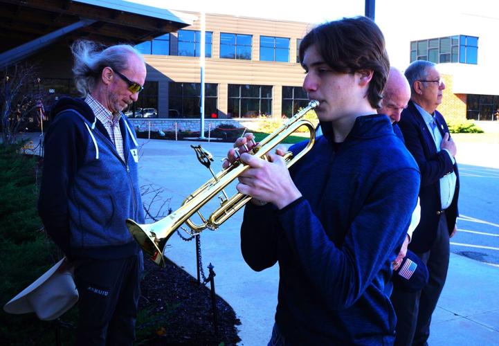 Williams Bay High School senior Hunter Johnson plays "Taps" at Nov. 9 Veterans Day program at WIlliams Bay Elementary School