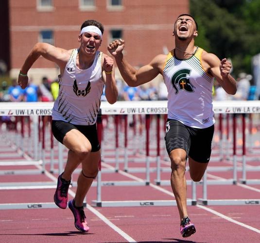 Hayward senior Lucas Hansen, left, attempts to catch up to Martin Luther senior Rylee Wendt, who celebrates his victory in the Division 2 boys 110-meter hurdles on June 6.