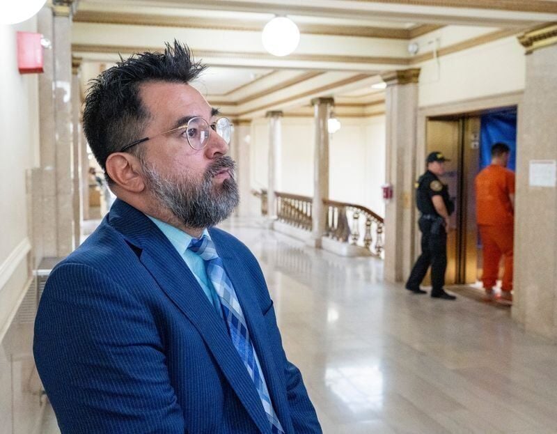 Kenosha County District Attorney Xavier Solis, left, stands in a hallway as Anthony Kanabay, right, is taken into custody after his sentencing before Jodi Meier in the Circuit Court Branch 7 courtroom at the Kenosha County Courthouse on Tuesday May 26, ...