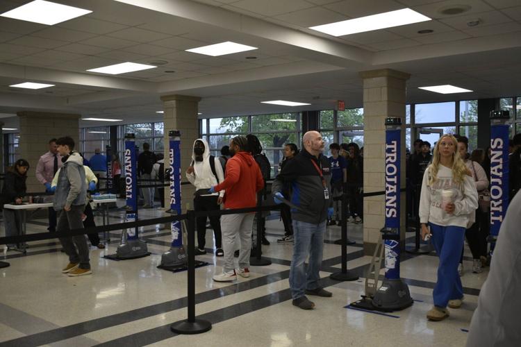 Tremper students line up to walk through metal detectors