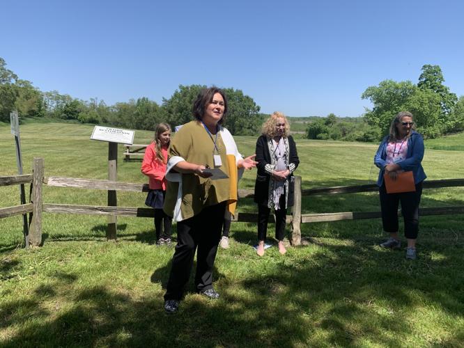 Stephanie Klett, president and CEO of Visit Lake Geneva, congratulates the students for completing the storybook trail