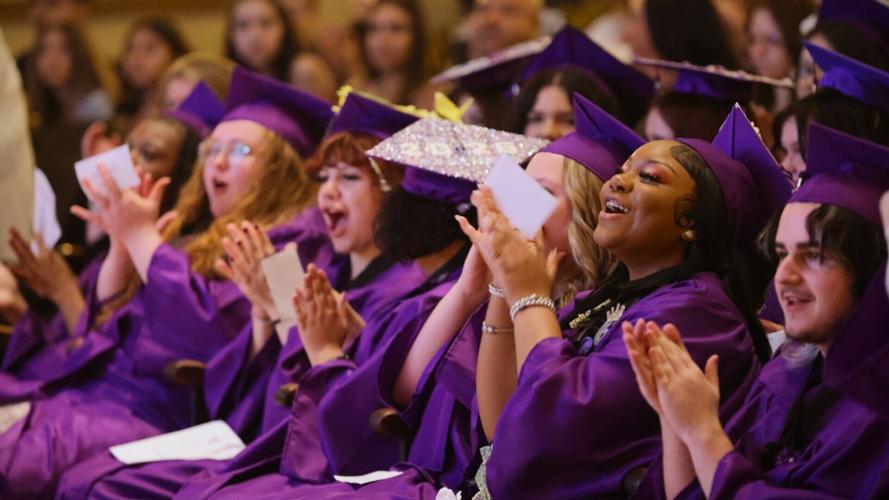 Reuther graduates appluad