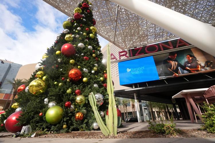 The sun shines on a decorative tree downtown on a warm Christmas Day in Phoenix on Dec 25, 2025.