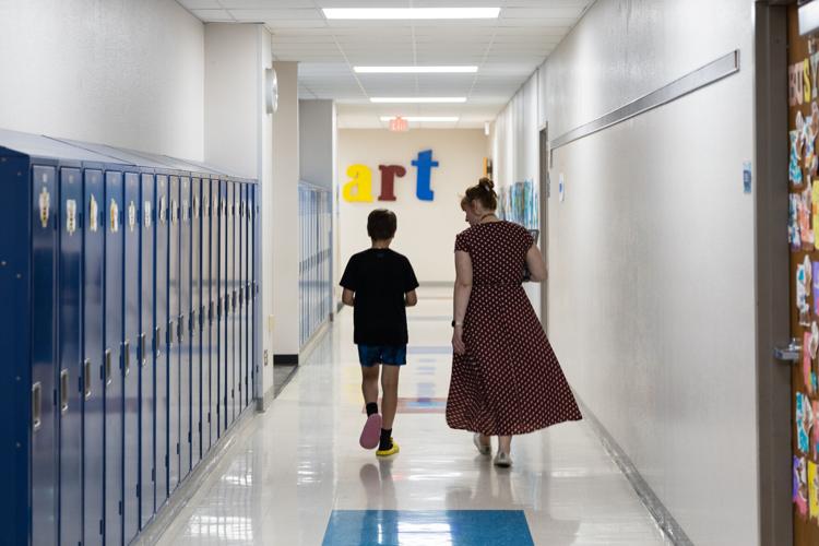Samantha Phillips walks through hall