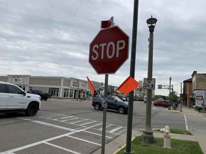 A flagged stop sign is located near the intersection of Broad Street and Geneva Street