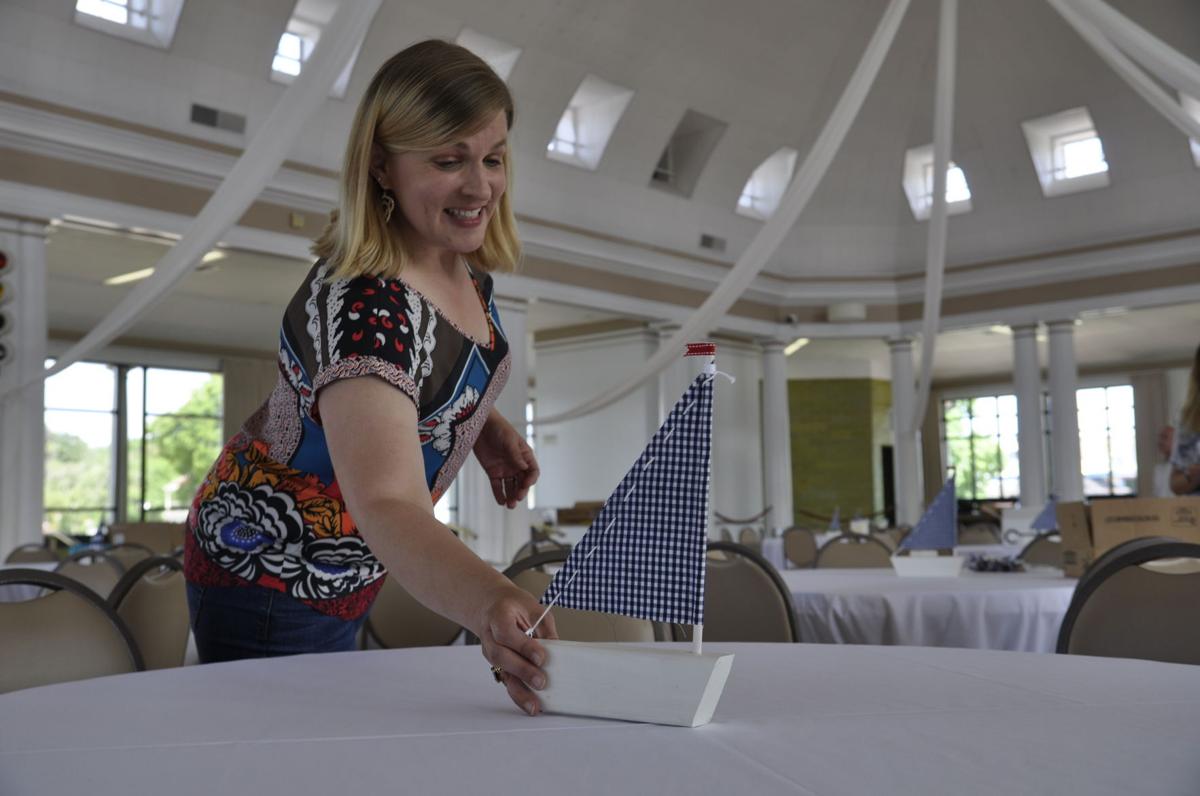 Kelly Jenk setting up for wedding inside Riviera