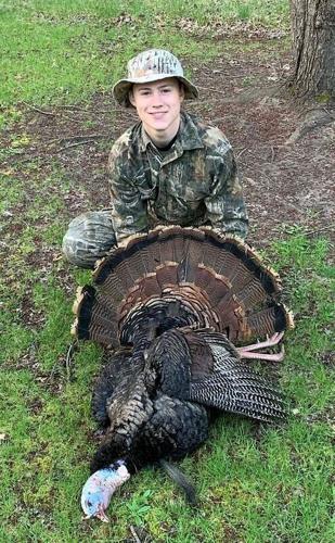 Carson Bender of Wisconsin Rapids poses with a wild turkey he shot during the 2025 Wisconsin spring turkey hunting season. Bender had an encounter with a bobcat April 18, 2026 while turkey hunting near Nekoosa that he recorded on video.