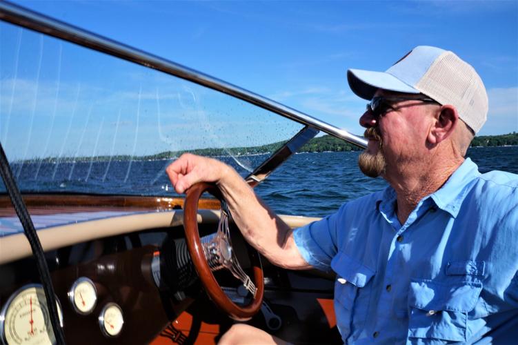 Grand Craft Boats senior marine technician Tim Williams skippers a Burnham runabout on Geneva Lake