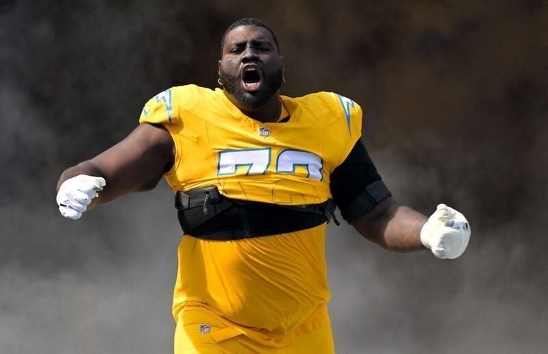 Oct 19, 2025; Inglewood, California, USA;  Los Angeles Chargers guard Mekhi Becton (73) runs on to the the field for the game against the Indianapolis Colts at SoFi Stadium. Mandatory Credit: Jayne Kamin-Oncea-Imagn Images