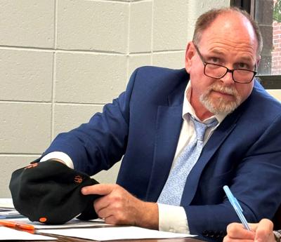 Williams Bay School District Administrator Dr. Bill White conducts a random lottery drawing for limited open enrollment seats