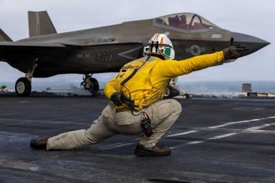 A U.S. sailor launches an F-35C Lightning II, assigned to Marine Fighter Attack Squadron 314, from the flight deck of Nimitz-class aircraft carrier USS Abraham Lincoln during the ongoing conflict with Iran Aug. 5, 2026.