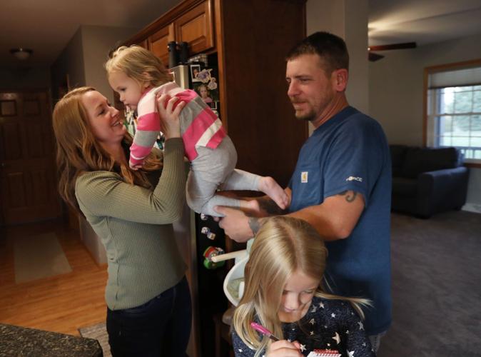 Caiti holding up Piper