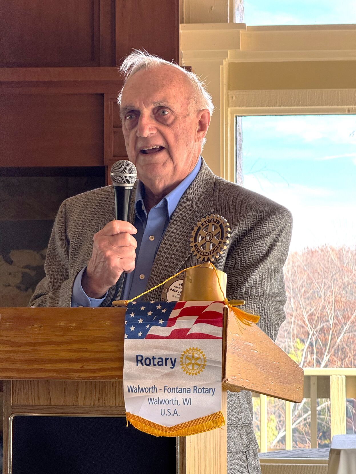 Rotarian Frank Breneisen delivers the keynote address at the Geneva Lake West Rotary Club's 75th anniversary luncheon