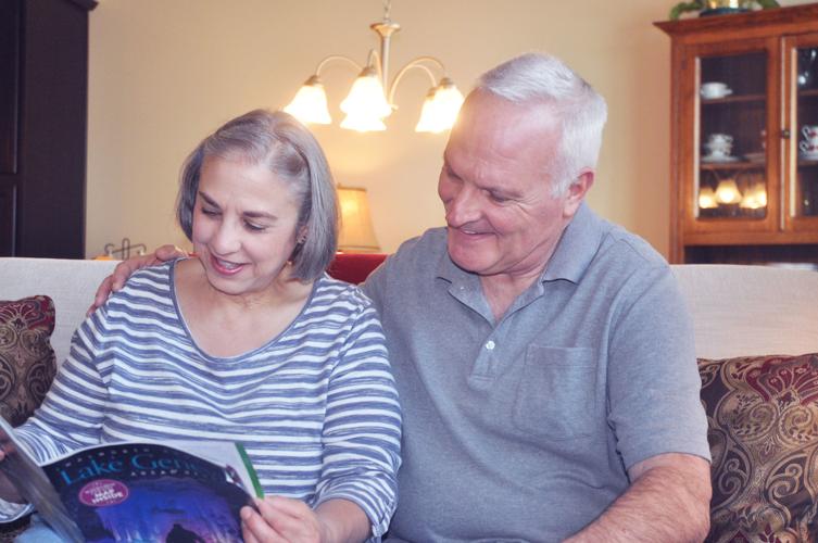 Nina and Greg Schipp do some reading in the living are of their home located in the Symphony BaY
