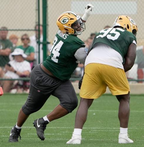 Packers defensive tackles Karl Brooks (94) and Devonte Wyatt (95) work on a drill during a training camp practice July 31.