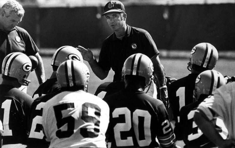 Green Bay Packers coach Dan Devine makes a point to his players during training camp in July, 1972. Devine coached from 1971-1974, with a record of 25-27-4.
