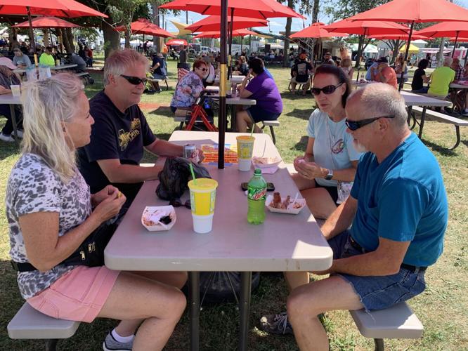 Matt and Janet Kuve and Jeff and Cheryl Greulich enjoy food and conversation