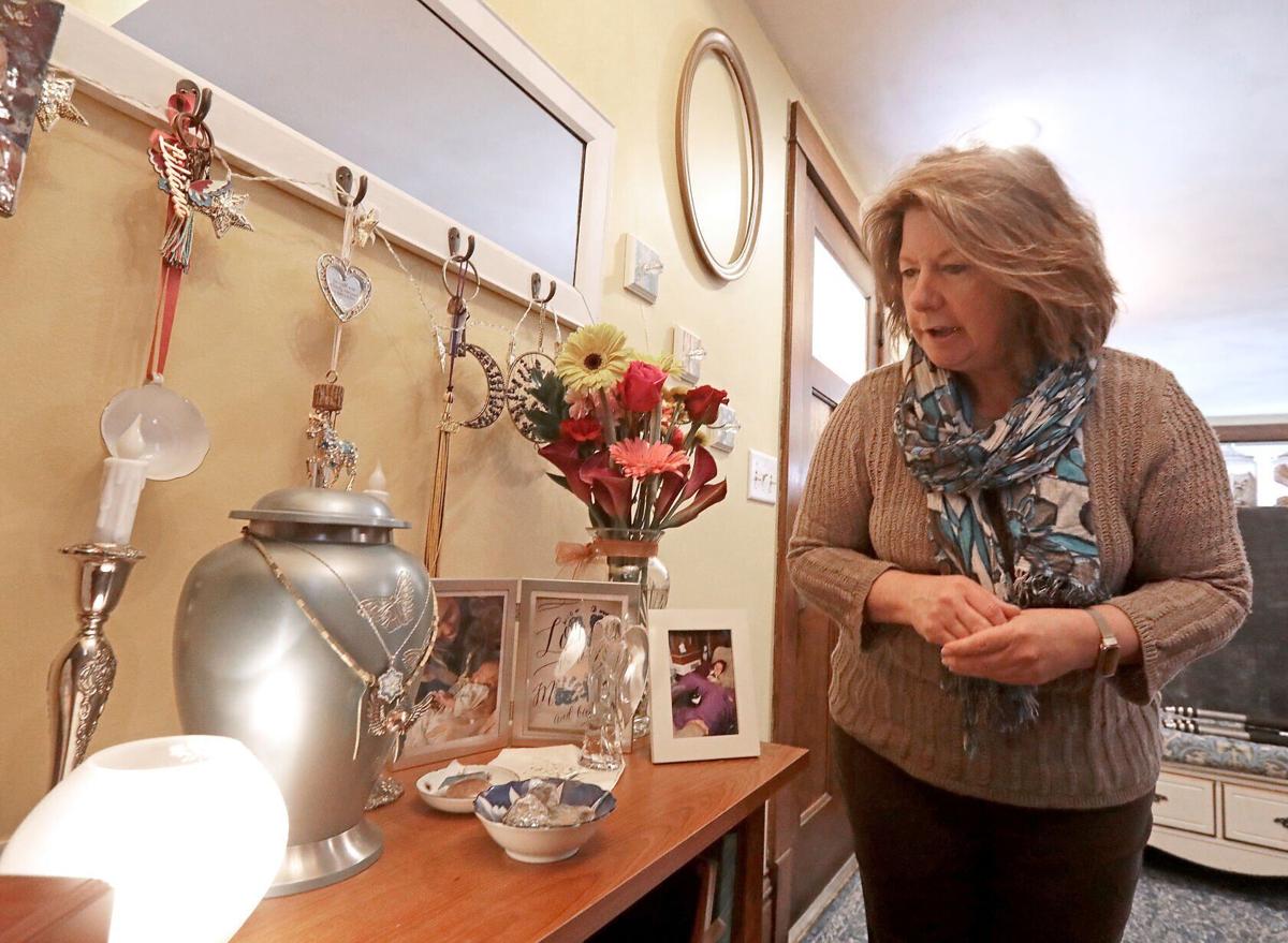 Lorre with urn and mementos