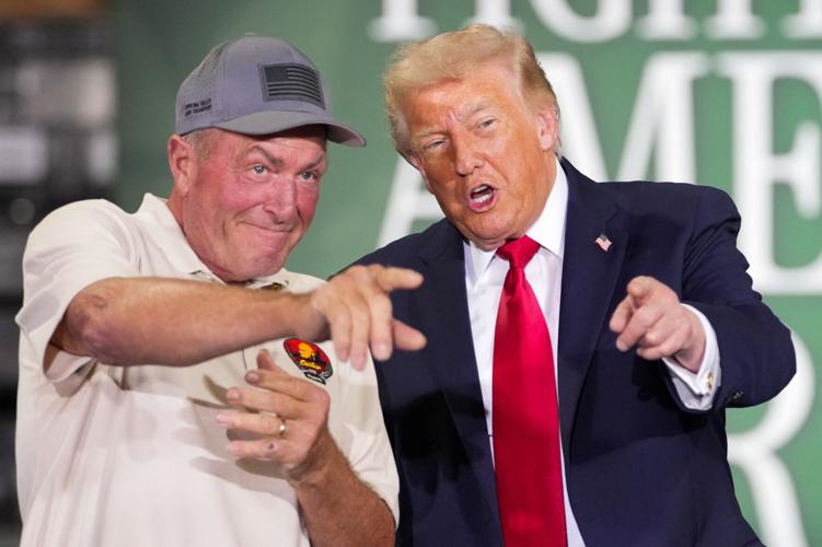 U.S. President Donald Trump stands next to Ken Custer during an event at Custer Farms in Chippewa Falls, Wisconsin, U.S., June, 5, 2026. REUTERS/Nathan Howard