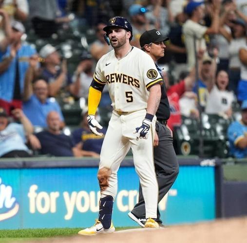 Milwaukee Brewers center fielder Garrett Mitchell reacts after hitting a triple against the Cincinnati Reds.