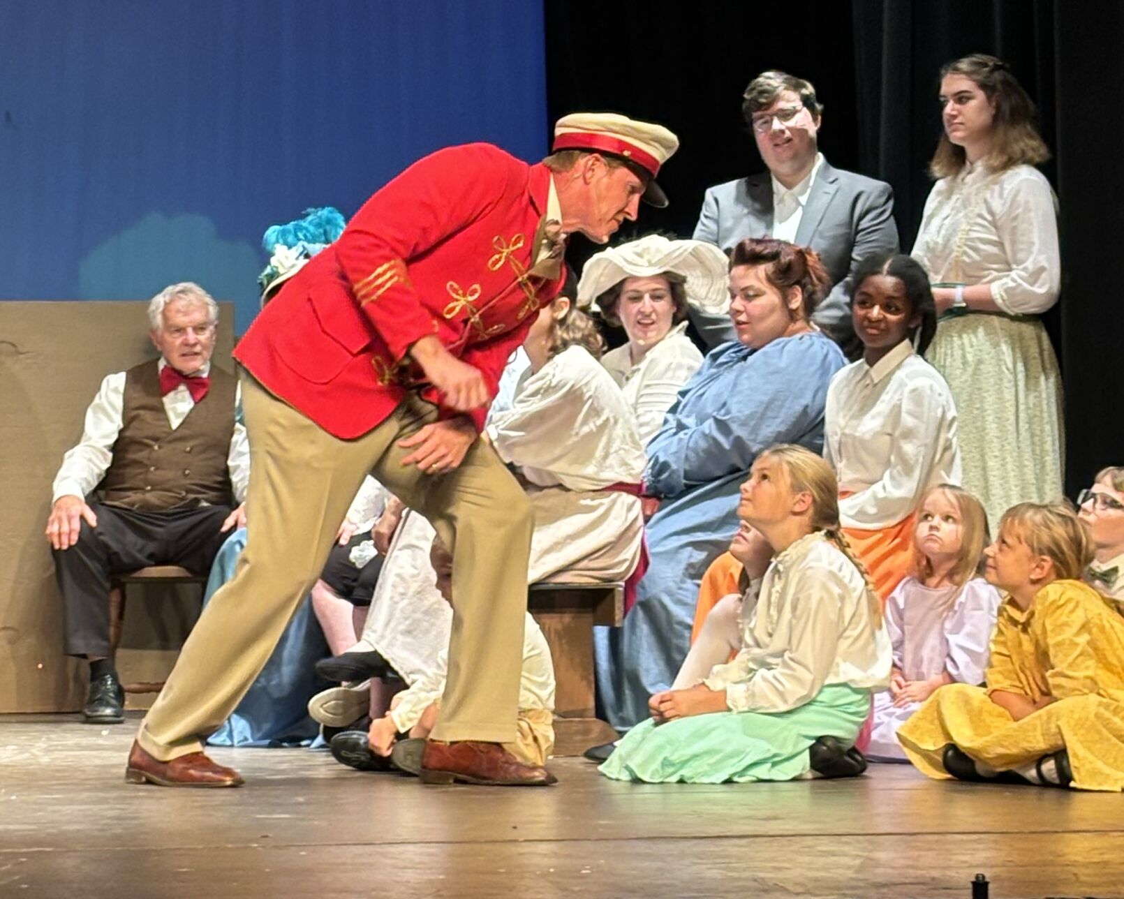 Cevin Moses, portraying Harold Hill, sings to the children during a scene of "The Music Main"