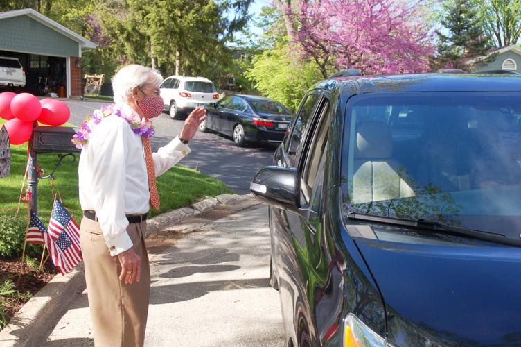 Gene Haseley steps off curb to greet his birthday parade