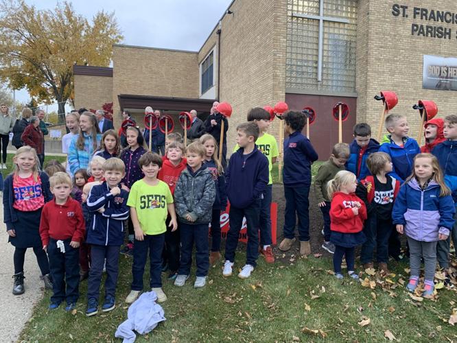 Several St. Francis de Sales Parish School students celebrate the groundbreaking of the school's future expansion project