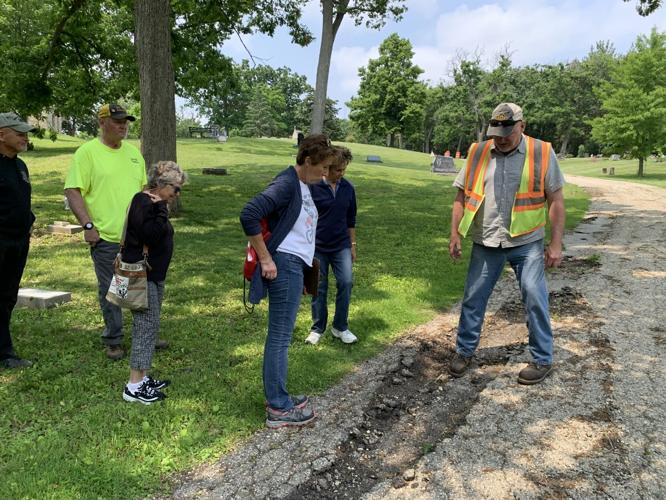Public Works Director Tom Earle, right, discusses road repair work that needs to be completed at Oak Hill Cemetery with members of the Cemetery Board