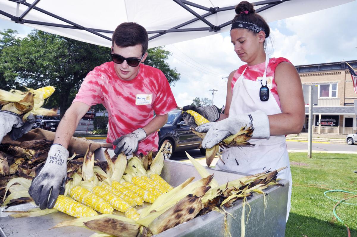 Shucking corn at Walworth Corn & Bratwurst Festival