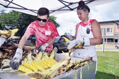 Shucking corn at Walworth Corn & Bratwurst Festival