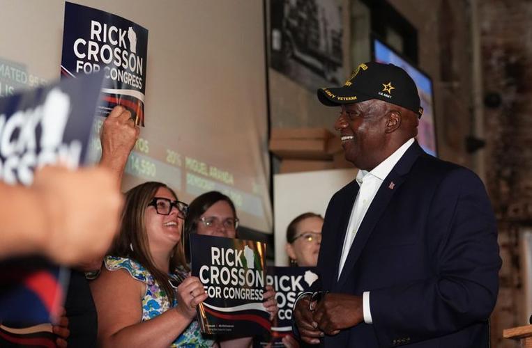 Rick Crosson, Democratic nominee for the 8th Congressional District, meets with supporters during his primary election watch party on Aug. 11 at Titletown Brewing Co. in Green Bay.
