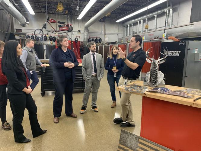 State Superintendent Jill Underly and school district officials receive information about Badger High School's metal workshop program (copy)