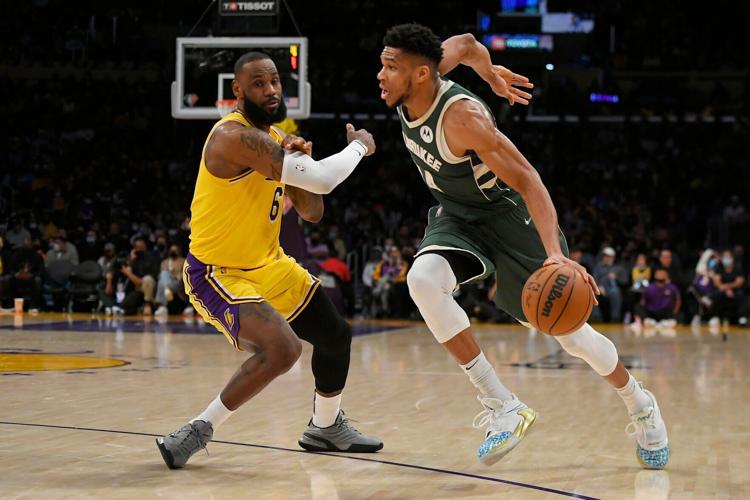LeBron James guards Giannis Antetokounmpo, AP generic file photo