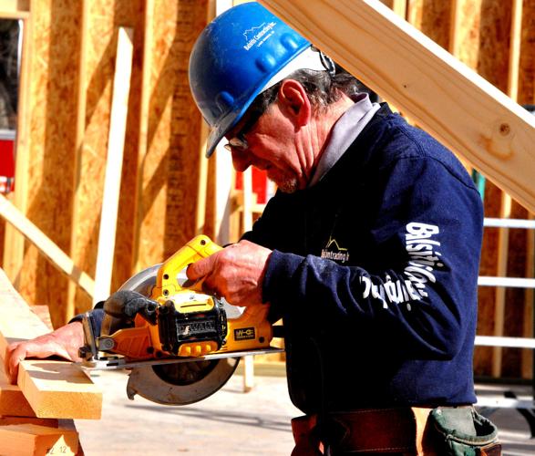 An employee from Balsitis Contracting does some drilling work