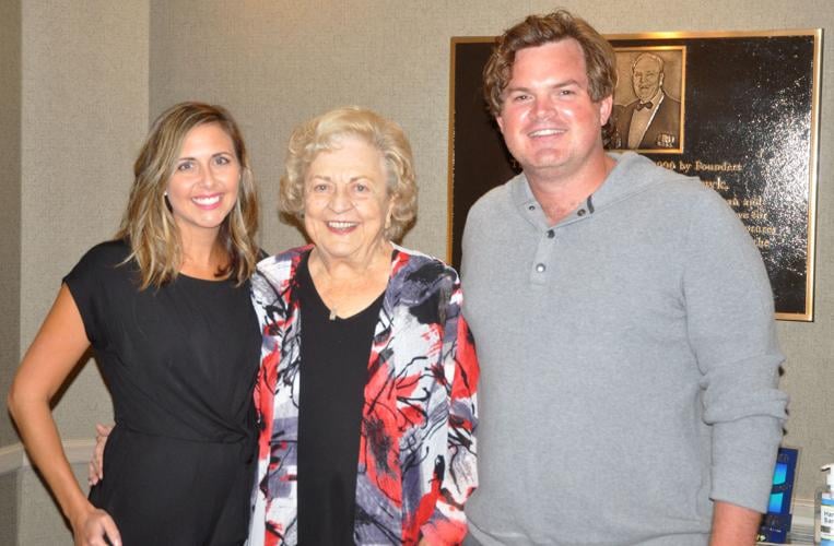 Geneva Inn co-founder Marilyn Schawk, center, stands in between Kara O'Dempsey and Adam O'Dempsey
