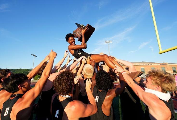 Homestead High School boys track team lifts senior Jemekhi Tally as he holds up the WIAA Division 1 State Track and Field championship trophy in La Crosse, Wisconsin on Saturday, June 6, 2026.