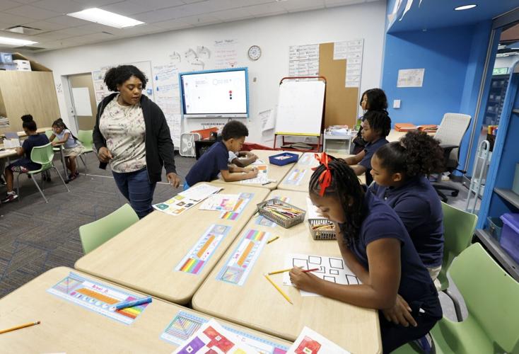 One City teacher works with third grade students