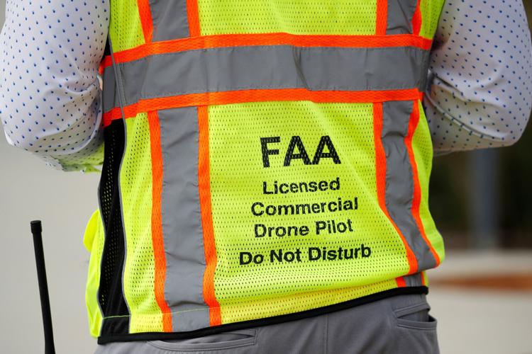 FILE PHOTO: A drone pilot flies his aircraft as UC San Diego Health as they launch a pilot project with UPS and Matternet testing the use of aerial drones to transport medical samples, supplies and document between hospitals in La Jolla, California