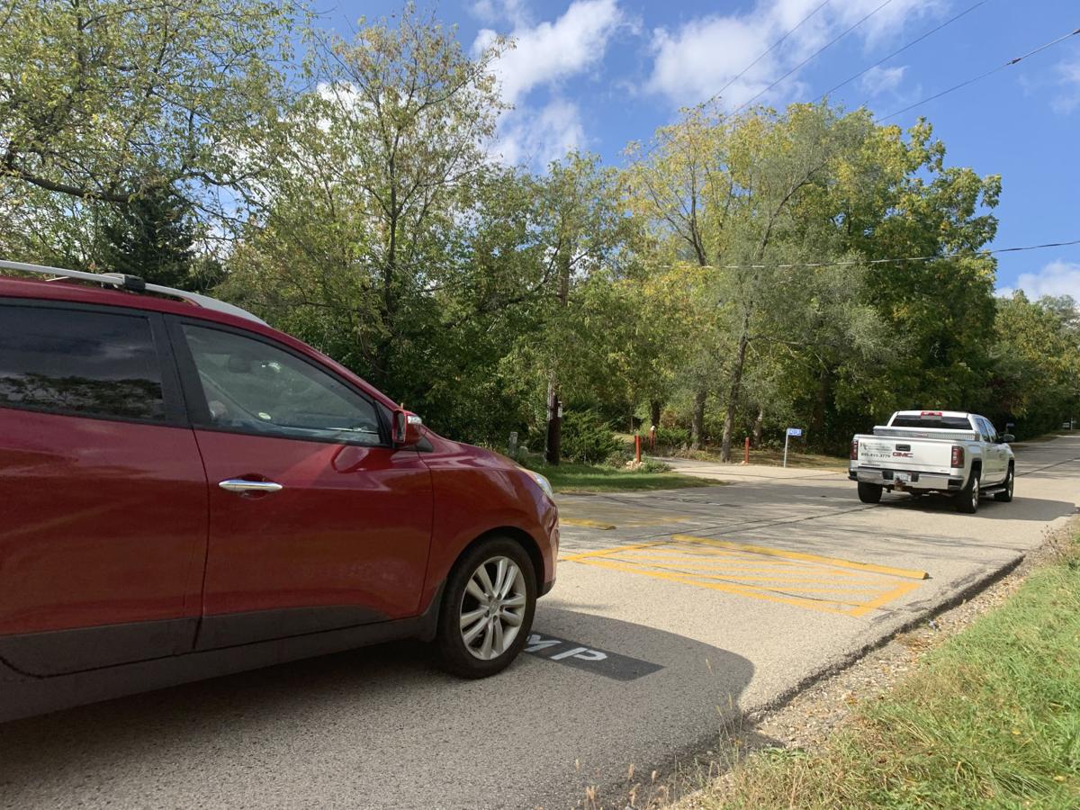 Vehicles drive over a speed bump