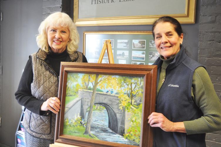 Local artist Nancy Newcomb donates a painting of a former railroad bridge to Geneva Lake Museum