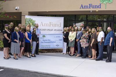 Racine Zoo receives check from AmFund