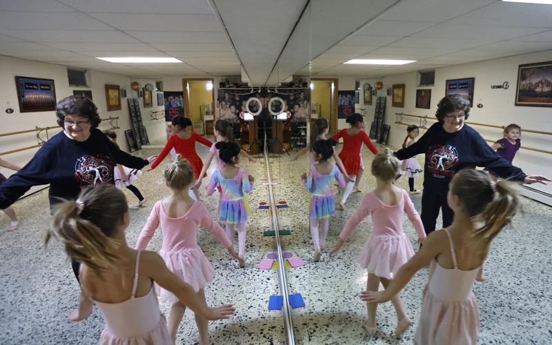 Betty Hayes-Baxter with dancers in mirror