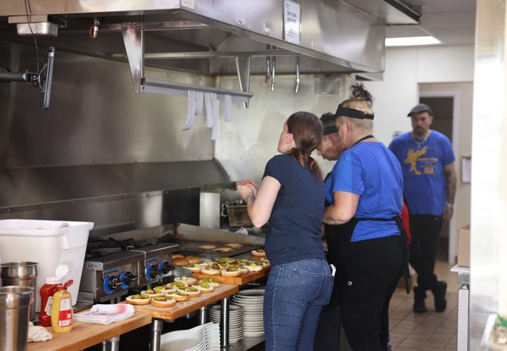 George Webb employees cooking burgers
