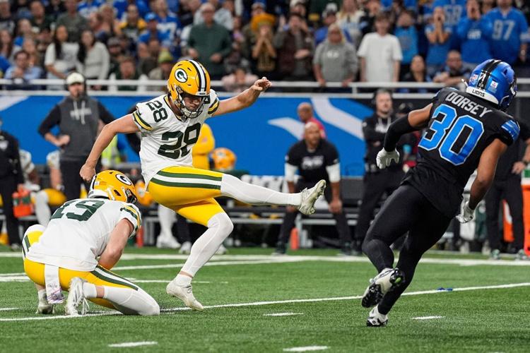 Green Bay Packers kicker Trey Smack (28) misses a field goal against Detroit Lions during the second half at Ford Field in