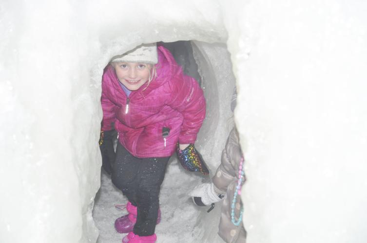 Girl in tunnel at ice castle