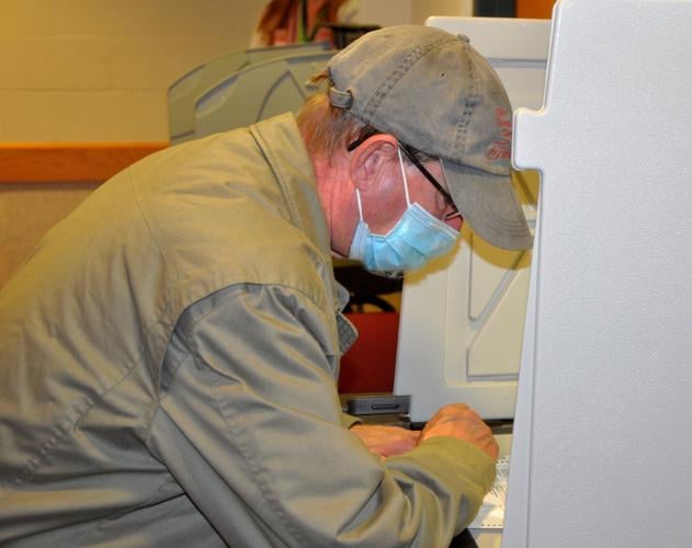 First-time voter Michael Canty of Lake Geneva prepares to cast his vote during the Nov. 3 presidential election