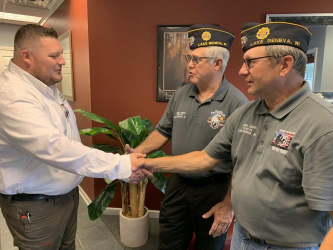 Lake Geneva American Legion Post No. 24 members thank Jack Schweider for donating $1,200 to the organization